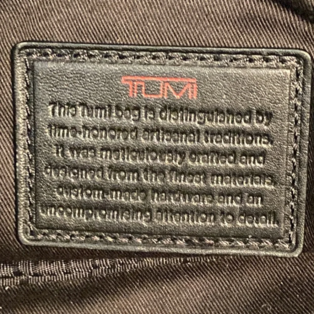 Tumi leather messenger tech lots of pockets